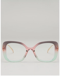 Detail of gradient oversized frames and slim gold metal temples of fashion eyewear