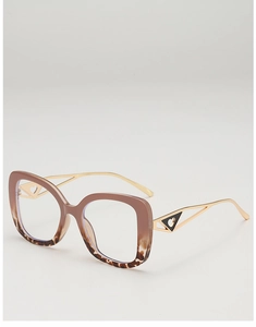 Detail of trendy large frame glasses with tortoiseshell finish and golden heart temples