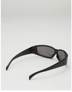Macro view of Y2K wrap-around sunglasses showing interior black glossy frame detail