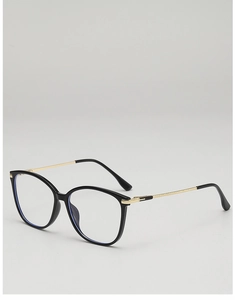 Detail view of black cat-eye frames with textured gold metal temples and blue light lenses