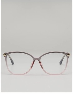 Close-up of gradient cat-eye frame with gold metal hinge and stylish finish