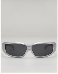 Close-up of silver cyberpunk sports sunglasses with futuristic streamlined frame design