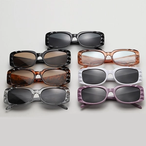 Close-up of faceted rectangular sunglasses in various candy colors showing diamond-cut edges