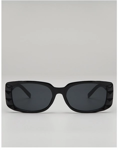 Detail shot of black rectangular sunglasses featuring geometric diamond-cut frame edges