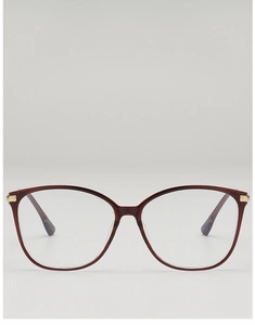 Close-up of deep wine red cat-eye frames with elegant golden metal hinge accents