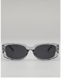 Front view of transparent grey rectangular sunglasses with dark lenses on a gradient background