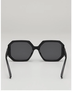 Front view of geometric polygon oversized sunglasses with black frame and dark lenses