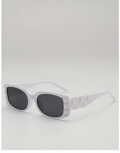 Detail shot of white rectangular sunglasses featuring a 3D geometric diamond texture frame