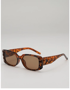 Detailed view of square sunglasses featuring amber tortoiseshell texture and geometric facets