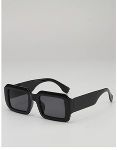 Detail view of glossy black rectangular sunglasses with dark UV protection lenses