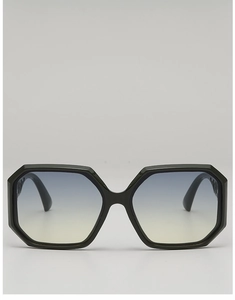 Detail of polygonal black frame sunglasses featuring gradient blue and yellow lenses