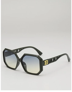Macro view of geometric oversized sunglasses with cutout B-logo and gradient lens