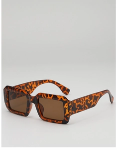Detail shot of vintage square sunglasses with tortoise shell frame and brown lenses