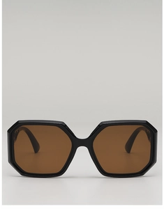 Detailed front view of black polygonal oversized sunglasses with brown gradient lenses