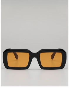 Detail of square black frame sunglasses with transparent orange ocean lenses and thick arms