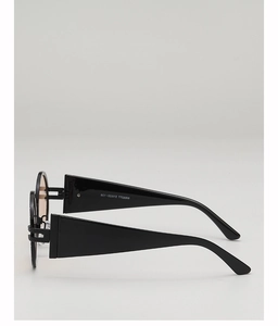 Side view of retro round sunglasses with black thick frames and light brown lenses