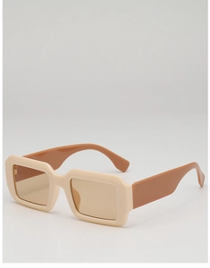 Detail view of cream square frame sunglasses with brown temples and light brown lenses