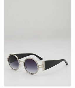 Detail of vintage round sunglasses with textured silver frame and purple gradient lenses