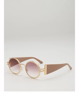 Detail of round sunglasses with frosted gold metal frames and gradient pink lenses