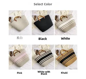 Detail view of woven tote bags in six colors with natural bamboo handles