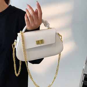 Detail of white crossbody bag with lychee texture leather and knotted handle design