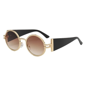 Retro round sunglasses with gold textured frames and gradient brown lenses for travel
