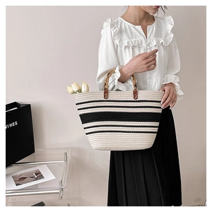 Minimalist striped woven tote bag with bamboo handles and chic retro casual design