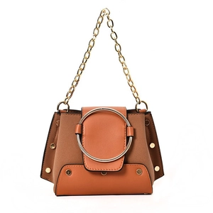 Vintage caramel crossbody bag with suede panels, gold ring buckle, and chain strap