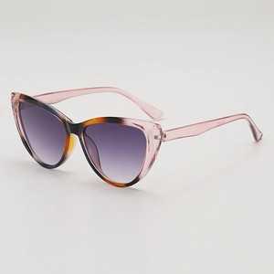 Cat eye sunglasses with pink tortoiseshell frames and purple gradient lenses in 45-degree view