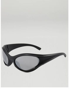 Detail view of futuristic matte black Y2K sports sunglasses with wraparound sleek frame