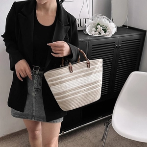 Striped woven tote bag for women with natural bamboo handles and spacious interior