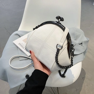 Chic white quilted shell bag with black metal chain strap and minimalist design
