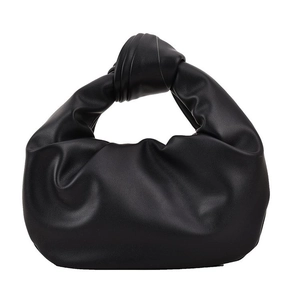 Minimalist black pleated cloud handbag with iconic knot handle design in soft leather