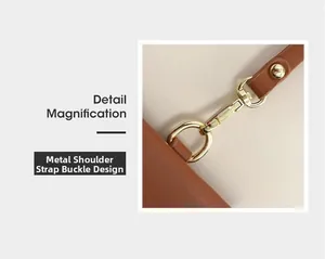 Détail de la boucle en métal doré et rivet sur un sac bandoulière en cuir marron