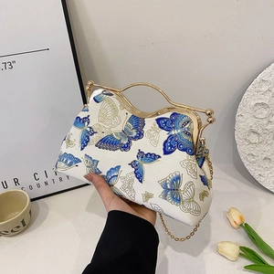 Elegant white crossbody bag with vintage blue butterfly prints and gold metal handle