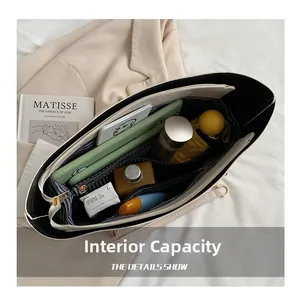 Interior view of large beige tote bag showing spacious compartments for daily essentials