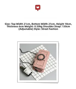 Detail of pink chain bag with rhinestone buckle and metallic studs decoration