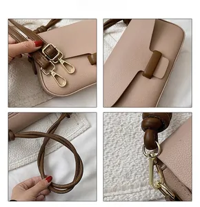 Close-up of litchi texture leather, golden hardware, and brown strap on a mini handbag
