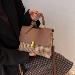 Vintage houndstooth patchwork handbag with brown leather flap and gold clasp
