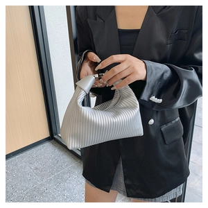 Silver pleated crescent handbag with vertical stripes and metallic finish for women