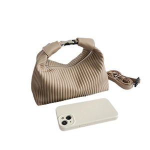 Pleated apricot hobo bag with top handle and shoulder strap shown with phone for scale