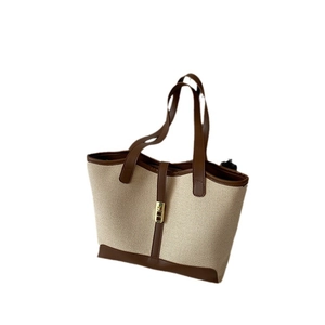 Classic canvas tote bag with brown leather trim and large capacity for daily use