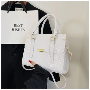 Minimalist white crocodile pattern crossbody bag with golden hardware and long strap