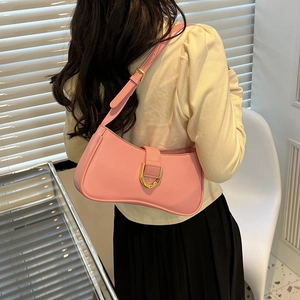 Adjustable shoulder strap detail on pink leather half-moon bag with golden metal buckle