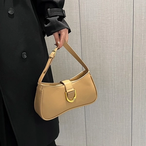 Classic khaki baguette shoulder bag with gold D-buckle detail for stylish daily commuting