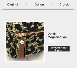 Detail showing smooth gold metal zipper with brown leather puller on leopard print bag