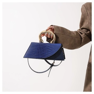 Dark blue crocodile pattern handbag with unique golden organic-shaped metal handle