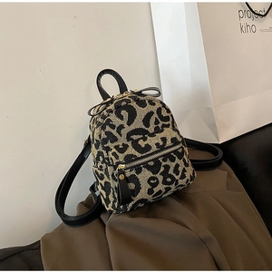 Mini leopard print backpack for women with gold hardware and adjustable straps