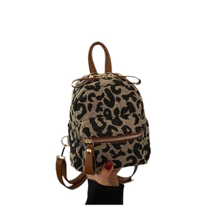 Chic leopard print mini backpack for women featuring brown faux leather trim and gold zippers