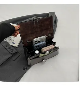 Detail view of the multi-compartment interior space in this vintage dark brown leather bag